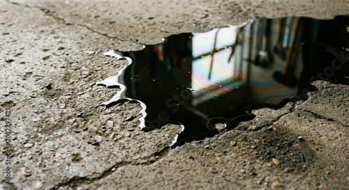 Oil stain spreading on concrete