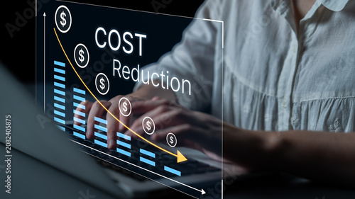Fotografie Analyzing Cost Reduction Strategies with Graphs and Digital Tools for Business Efficiency Improvement and Financial Planning