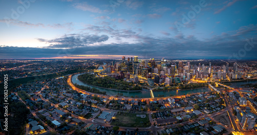 Wide dawn panorama of Calgary skyline and Bow River