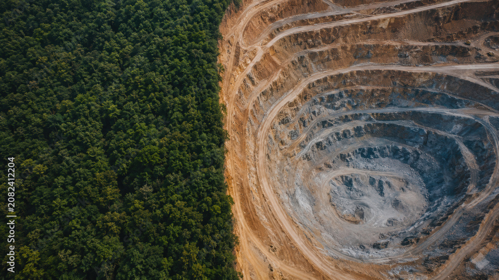 Fototapeta premium Aerial View of Resource Extraction Next to Rainforest