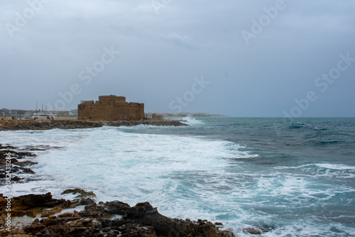 Waves Crushing into rocks on Coast in Paphos, Cyprus. Water hits shore of Mediterranean sea 