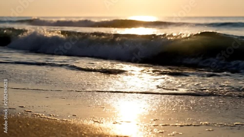 Slow Pan Along Rolling Ocean Waves Crashing Gently Onto Shore