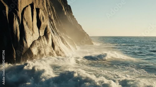  Static Shot Of Waves Breaking Repeatedly At The Base Of A cliff