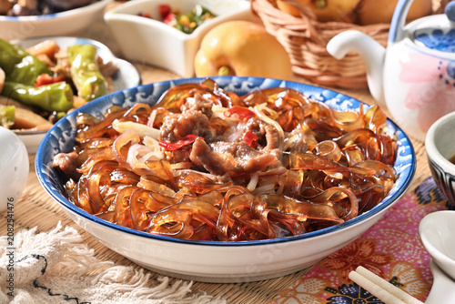 cantonese-styles stir-fried beef wideglass noodles on the plate