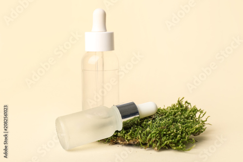 Bottles of serum and green ...