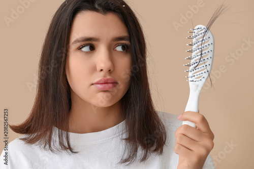 Stressed young woman with h...