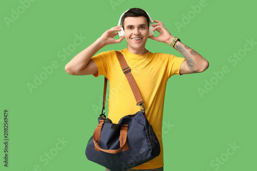 Young man with sports bag a...