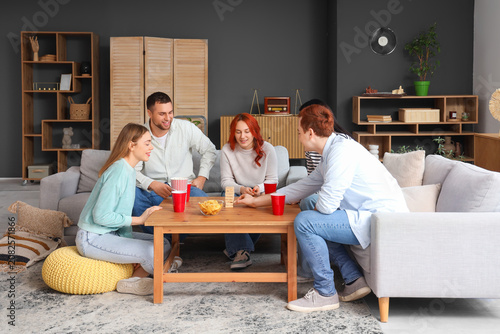 Group of young friends play...