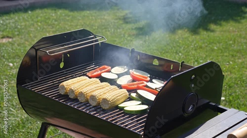 Summer grilling with fresh corn and colorful vegetables