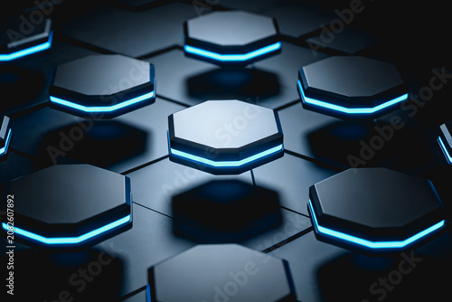 3D rendered image showing glowing blue hexagonal modules arranged on a dark smooth surface, futuristic tech design.