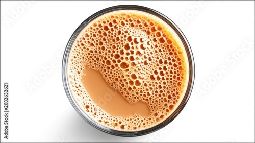 Foamy drink in clear glass close up