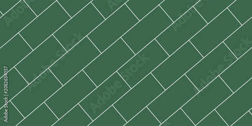 Wide green subway tile wall, with a classic horizontal brick pattern texture