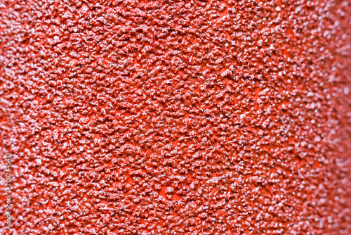 Obraz na plátně Close up of rough red textured surface with uneven pattern and glossy finish, cr