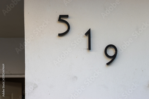 Modern Metal House Number on Exterior Wall