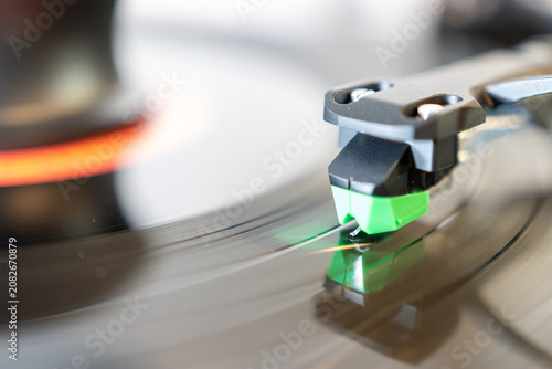 Macro Close-Up of Turntable Stylus Playing a Vinyl Record