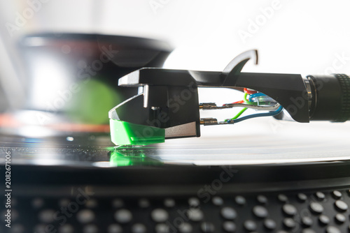 Macro Close-Up of Turntable Stylus Playing a Vinyl Record