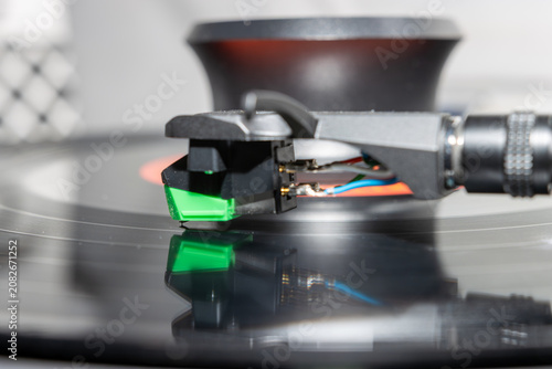 Macro Close-Up of Turntable Stylus Playing a Vinyl Record
