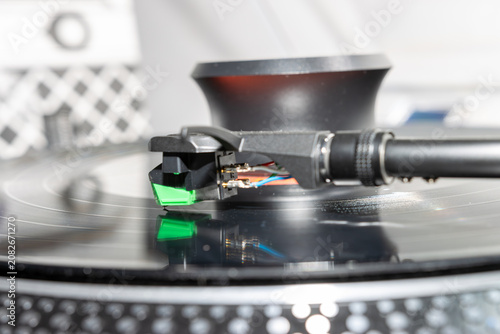 Macro Close-Up of Turntable Stylus Playing a Vinyl Record