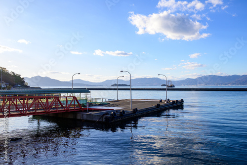 Scenic view of a red pier and ferry dock in the Seto Inland Sea