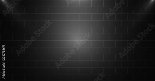 Dark Brick Wall Background with Soft Spotlight and Industrial Urban Texture