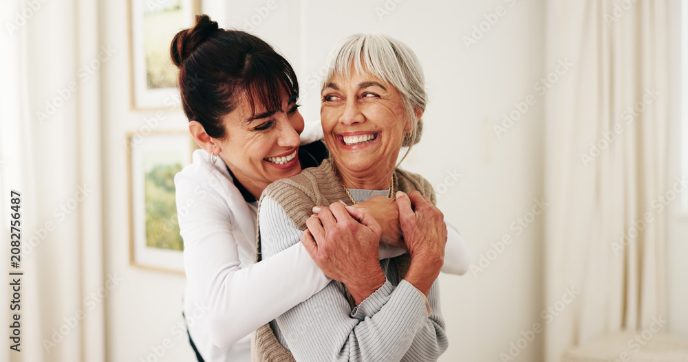 Fototapeta premium Hug, laughing and woman with senior parent in home for bonding, relationship or visit. Care, funny and smile of adult daughter embracing mother in apartment together for connection or retirement