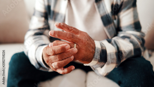Schilderij op canvas Hands, ring and thinking with old man on sofa in home living for grief, loss or pain as widower