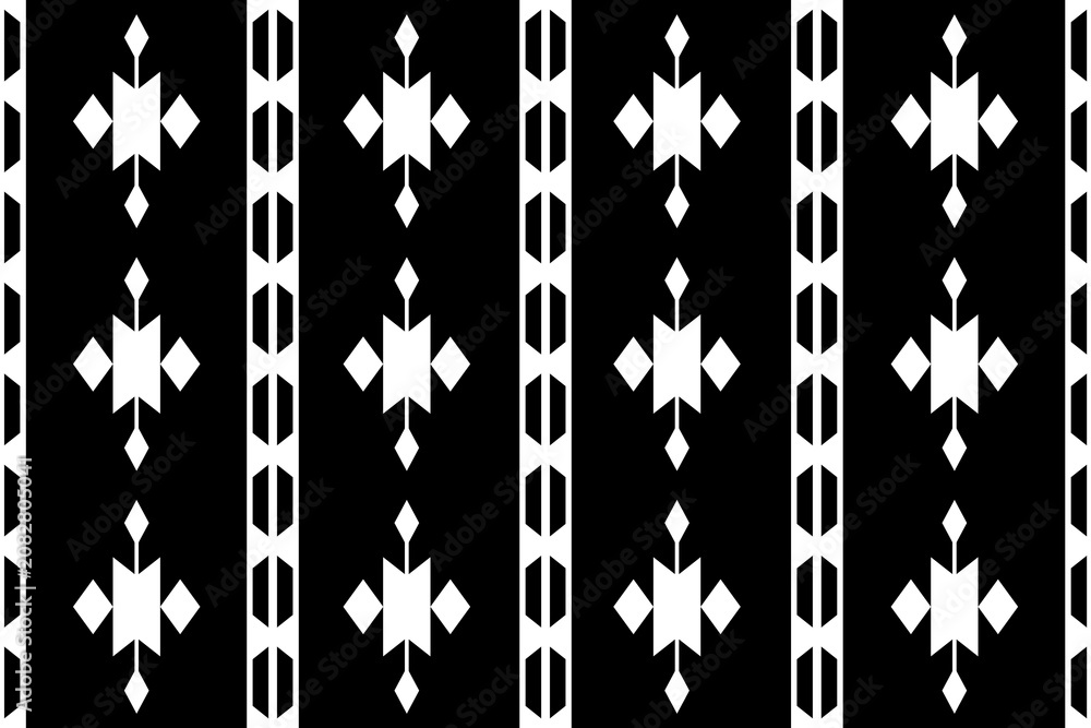 Fototapeta premium Minimalist black and white geometric vertical border seamless pattern vector. Ethnic tribal design with black background and white chevron motifs. Decorative traditional folk textile.