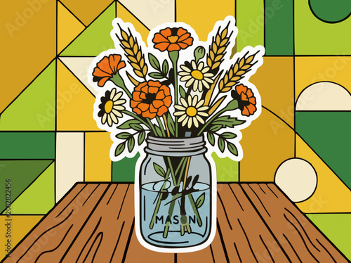 Colorful flowers and wheat in a mason jar on a wooden table with a geometric background