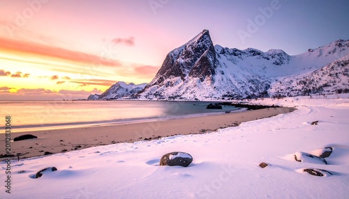 Snowy beach mountain landscape at sunset with pastel sky and ocean