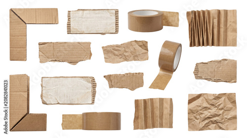 Collection of various torn and rolled pieces of brown and beige cardboard and paper in different shapes and textures.