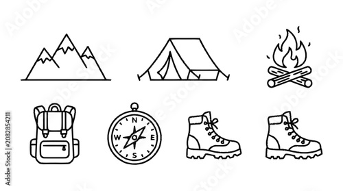 Photos Hikers prepare for adventure with gear and campfire in mountain landscape