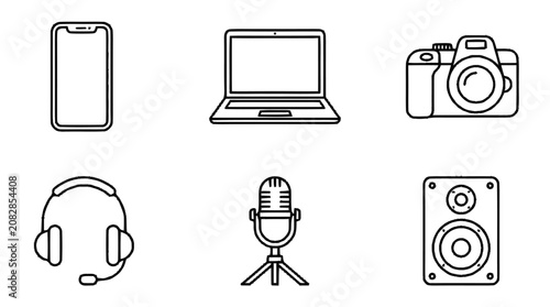 Foto A collection of electronic devices and gadgets on display including phone, laptop, camera, headset, microphone, and speaker