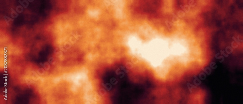 Fotografie Abstract fiery orange and red gradient texture with bright glowing central area