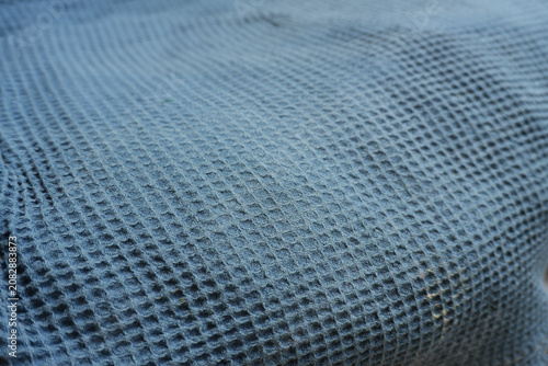 Photos Soft focus of blue waffle weave textile with shallow depth of field, honeycomb f