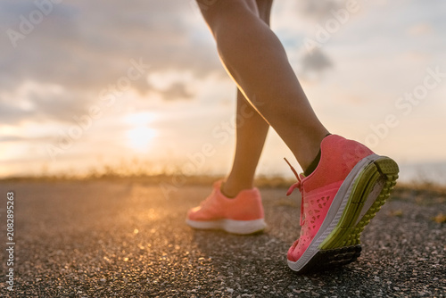 Legs of a running woman