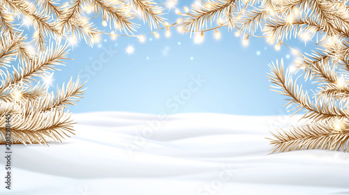 Snow-covered pine branches decorated with glowing fairy lights form a wintery frame against a clear blue sky and snowy landscape.
