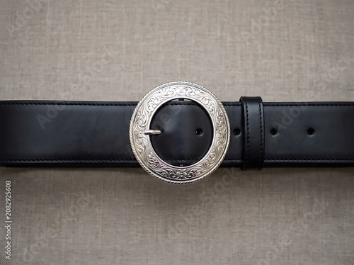 Black Leather Belt with Ornate Silver Buckle.