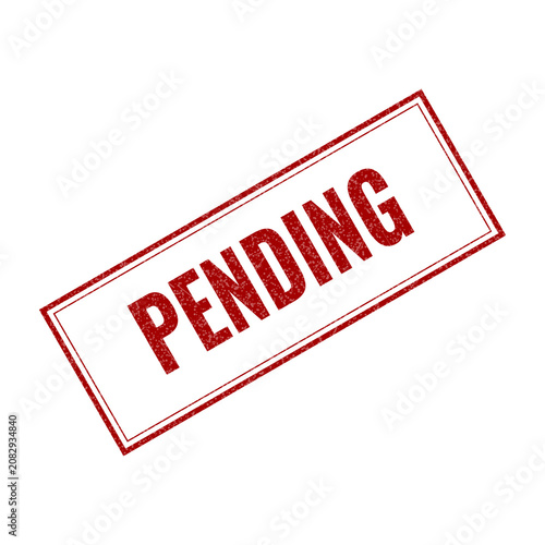 Red pending rubber stamp mark on document
