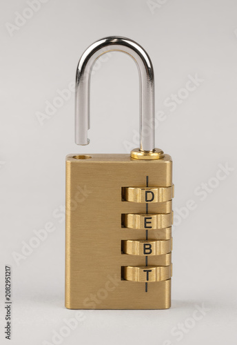 Unlocked Combination Lock Spelling Debt as Financial Freedom Concept
