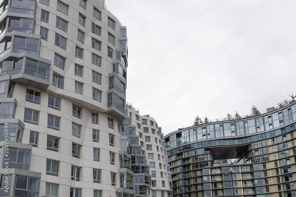 Fototapeta premium Contemporary apartment complex with unique curved facade