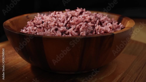Cooked Riceberry Rice in a Wooden Bowl on a Wooden Table