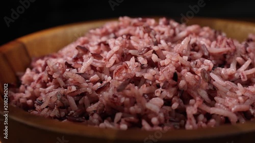 Cooked Riceberry Rice in a Wooden Bowl on a Wooden Table