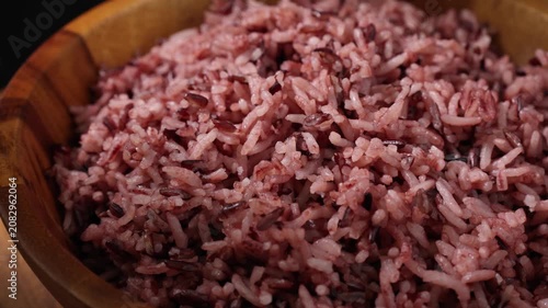 Cooked Riceberry Rice in a Wooden Bowl on a Wooden Table