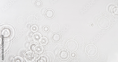 Картината върху платно Top view of waterdrop dropping on a surface of water