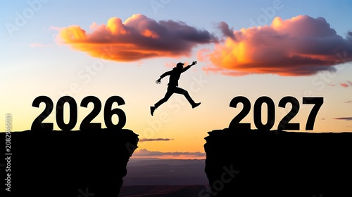 Transition from 2026 to 2027 with businessman jumping across cliff and new year success concept
