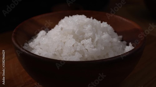 Dolly Shot of Natural Sea Salt in a Wooden Bowl
