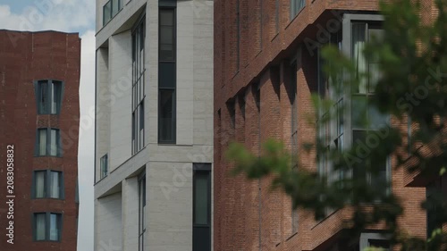 The facade of a modern building is made of brick. Handheld