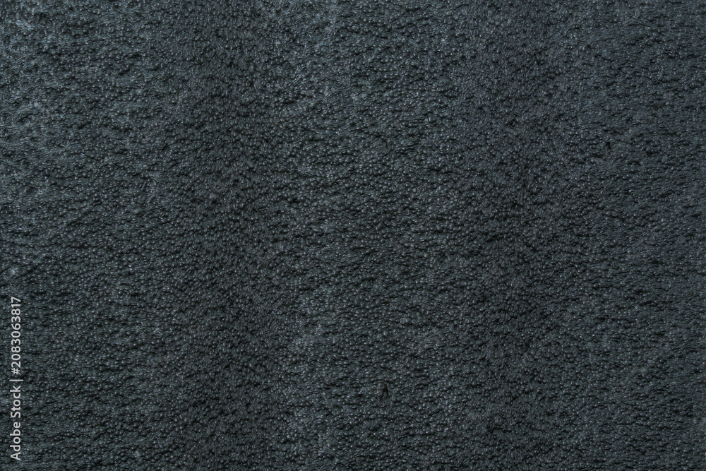 Fototapeta premium Dark rough fabric surface creating abstract texture background
