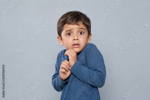 Child's innocent face reflects a sudden jolt of pure trepidation