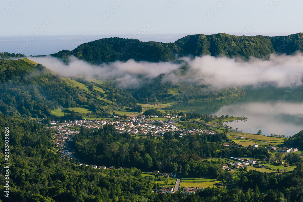 Fototapeta premium Sete cidades village and lake with clouds são miguel azores